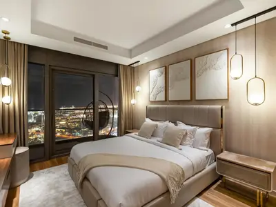 a bedroom with a large bed and a large window at Burj View 3BDR with Rooftop Infinity Pool in Dubai
