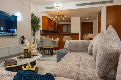 a living room with a couch and a table at Central Park Towers Royal suite DIFC Downtown in Dubai