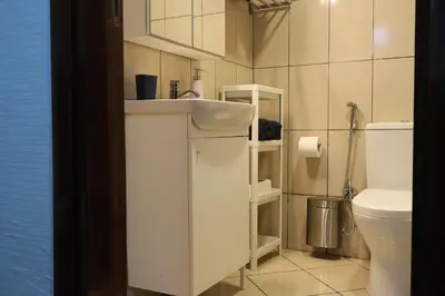 a bathroom with a sink and a toilet at Cosy 1 bed in Dubai Marina in Dubai
