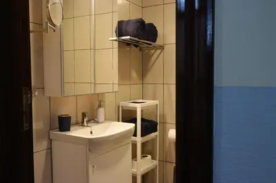 a bathroom with a sink and a mirror at Cosy 1 bed in Dubai Marina in Dubai