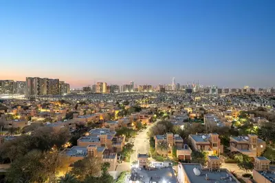 an aerial view of a city at night at FIRST CLASS 1BR Stylish Urban Retreat in Dubai