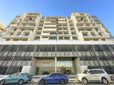 three cars parked in front of a large building at FIRST CLASS 1BR Stylish Urban Retreat in Dubai