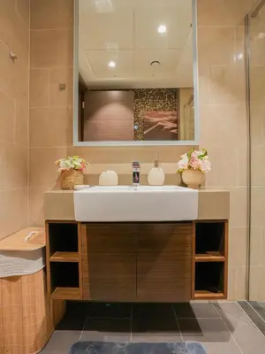 a bathroom with a sink and a mirror at Luxury 2BR in Sobha Hartland in Dubai