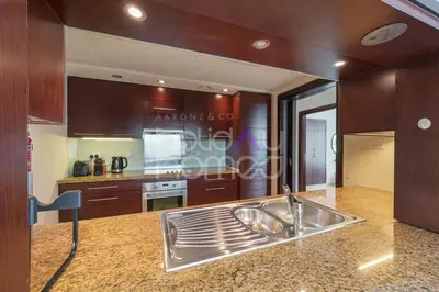 a kitchen with a sink and a counter top at Modern 1BR in Burj Views Tower Downtown in Dubai