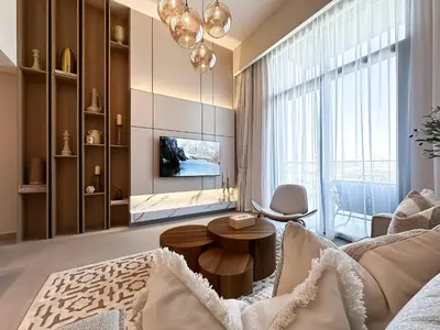 a living room with a couch and a table at Trophy-Aesthetic Apartment w Skyline and Dubai in Dubai