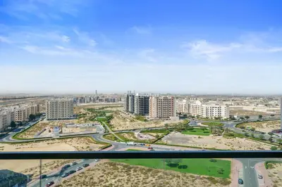 a view of a city with buildings and roads at Modern Studio with all Amenities Ideal Location in Dubai