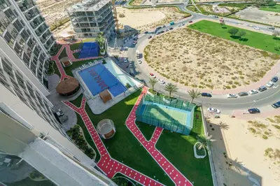 an overhead view of the pool at a resort at Modern Studio with all Amenities Ideal Location in Dubai