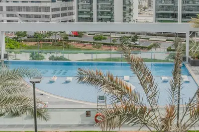 an overhead view of a large swimming pool in a city at Clever Guest 029 Bella Rose in Dubai