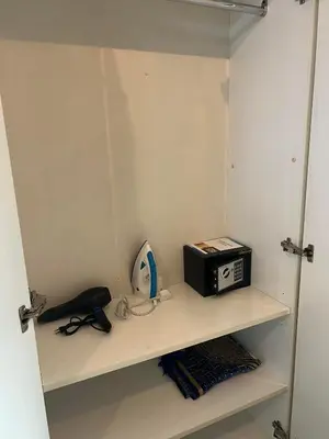 a shelf with a toaster and a radio on it at MarinaBliss in Dubai