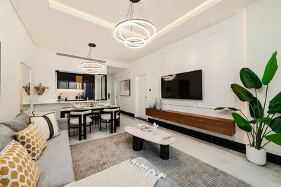 a living room with a couch and a tv at Luxury Apartment in Business Bay in Dubai