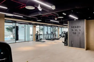 a gym with treadmills and cardio equipment in a building at Luxury Apartment in Business Bay in Dubai