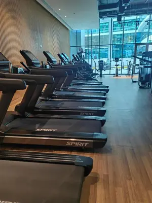 a row of treadmills lined up in a gym at 7 palm Jumeirah one bedroom in Dubai