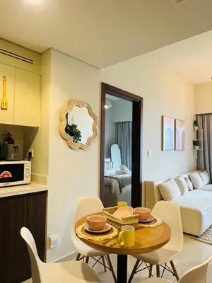 a room with a table and chairs and a bedroom at Boho 2bhk near Dubai mall with best nightlife in Dubai