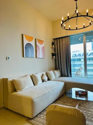 a living room with a couch and a table at Boho 2bhk near Dubai mall with best nightlife in Dubai