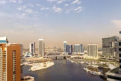 a view of a city with boats in the water at Boho 2bhk near Dubai mall with best nightlife in Dubai