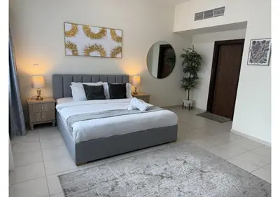 a bedroom with a large bed and a mirror at Centrally Located in Business Bay - Huge 1 Bedroom Hall in Executive Towers in Dubai