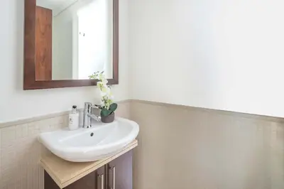 a bathroom with a sink and a mirror at Frank Porter - Beauport Tower in Dubai