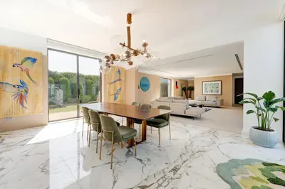 a dining room with a table and chairs at Resort Villa 19 in Dubai