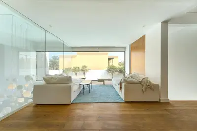 a living room with two white couches and a table at Resort Villa 19 in Dubai