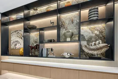 a display case in a room with vases and other items at FIRST CLASS 4BR Burj Khalifa & Fountain View in Dubai