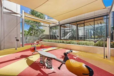 a building with a playground with a surfboard on it at FIRST CLASS 4BR Burj Khalifa & Fountain View in Dubai
