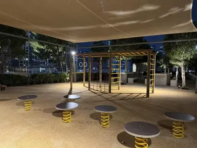 a playground with benches and tables in a building at Walk to Dubai Mall- Enjoy Burj Khalifa Show in Dubai