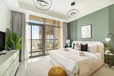 a bedroom with a large bed and a large window at Silkhaus Cozy Studio at Business Bay in Aykon City in Dubai