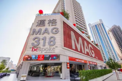 a store with a sign on the side of a building at CAICAI Homes Mag 318 Dubai Walking Distance to Dubai Mall in Dubai