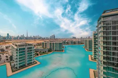 an aerial view of a river between buildings at Luxury 2 Bedroom plus kids room Burj Khalifa View in Dubai