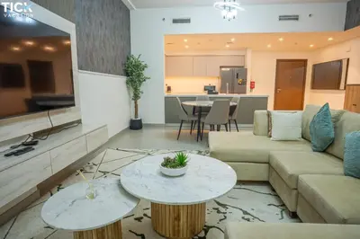 a living room with a couch and a table at 2BR Luxury Apartment Forte 2 Downtown 14th Floor in Dubai
