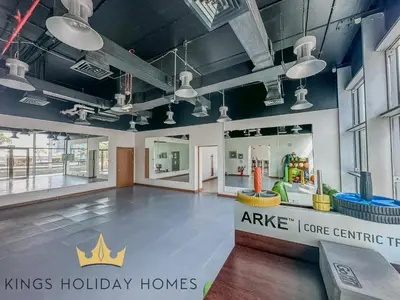 a large room with a kings holiday homes sign on the wall at Central Park towers Difc Royal suite kings in Dubai