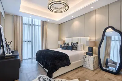 a bedroom with a large bed and a large mirror at Stylish 2BRUrban Retreat 10 Min to Burj Khalifa in Dubai