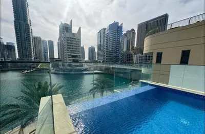 a swimming pool on a building with a view of a city at Luxury Sea View Studio in Dubai Marina in Dubai