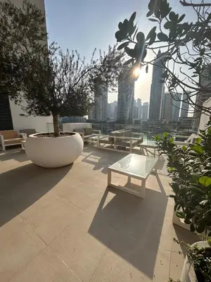 a bench sitting on top of a building at Luxury Sea View Studio in Dubai Marina in Dubai