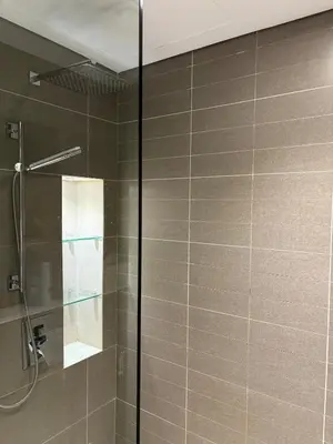 a shower with a glass door in a bathroom at Luxury Sea View Studio in Dubai Marina in Dubai
