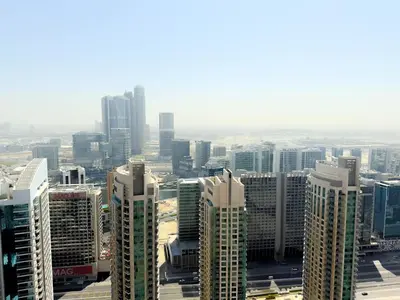 an aerial view of a city with tall buildings at INA HOMES - Burj Royal 1 BR Stylish Apartment in Dubai