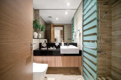 a bathroom with a sink and a toilet at Sunset serenity - Urban Oasis Business Bay in Dubai