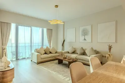 a living room with a couch and a table at 60th High Floor - full World islands, Downtown and Ocean View - high quality Design and Furniture - 2 Bedroom in Dubai