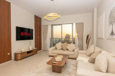 a living room with a couch and a table at 60th High Floor - full World islands, Downtown and Ocean View - high quality Design and Furniture - 2 Bedroom in Dubai
