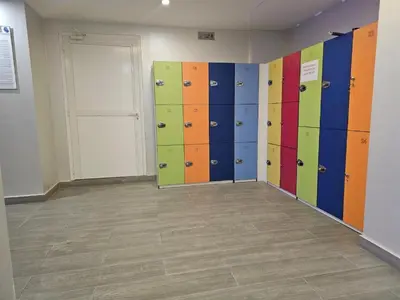 a room with colorful lockers and a door at Dubai Silicon Oasis Holiday Homes in Dubai