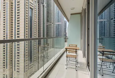 a balcony with a view of the skyscrapers at Elegant 1BR in Ocean Heights in Dubai