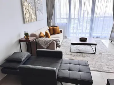 a living room with a couch and a coffee table at Elegant 1BR in Ocean Heights in Dubai