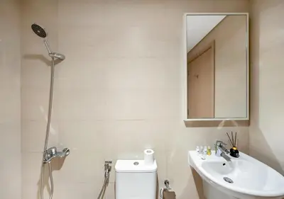 a bathroom with a sink and a mirror and a toilet at Luxury 3 BR Full Burj Khalifa and Fountain View in Dubai