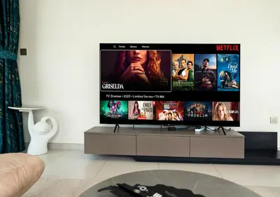 a flat screen tv in a living room at Luxury 3 BR Full Burj Khalifa and Fountain View in Dubai
