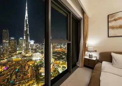 a room with a view of a city at Luxury 3 BR Full Burj Khalifa and Fountain View in Dubai