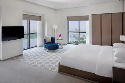 a hotel room with a large bed and a television at Hyatt Regency Creek Heights Residences in Dubai