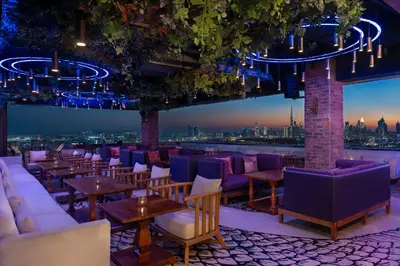 a bar with purple furniture and a view of the city at Hyatt Regency Creek Heights Residences in Dubai
