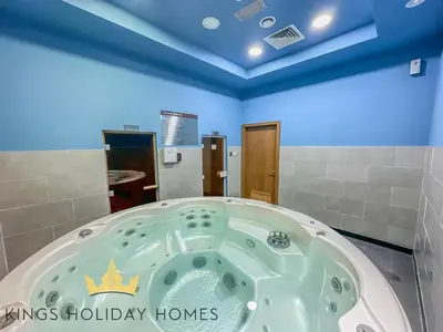 a jacuzzi tub in a bathroom with blue ceilings at Central Park towers Difc suite kings in Dubai