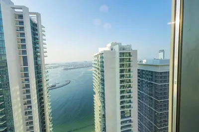 a view of the ocean between two tall buildings at Marina Vista - Elegant 1BR- 2606 in Dubai