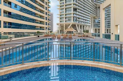 a swimming pool in a building with buildings at Frank Porter - RBC Tower in Dubai
